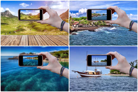 Woman photographs the beautiful landscape on a mobile phone . Close-up of hands.の写真素材