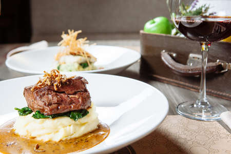 Grilled meat with mashed potatoesの写真素材