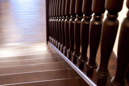Modern brown oak wooden stairs, view from top, classic home style beautyの写真素材