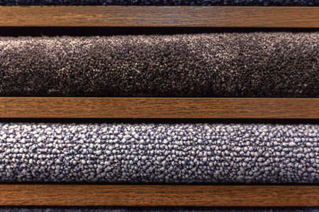samples of multi-colored carpets on the shelvesの写真素材