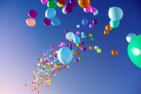 colorful balloons on a blue sky background