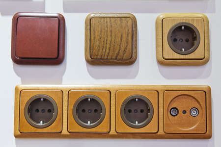 modern electrical outlets and switches on the wall