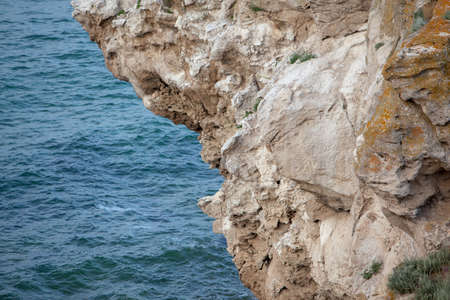 Stone rock close up in the sea water.の写真素材