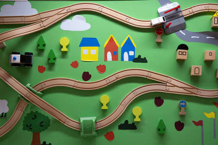 A toy railway with a train made of wood, top viewの写真素材