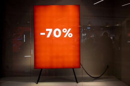 70 Percent Bright Red Sale Background with glowing numbers. window with space for text.Sign in a...