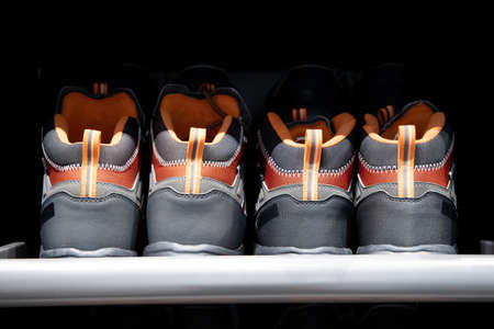Men's sneakers on the shelf. Sports shoes for active lifeの写真素材