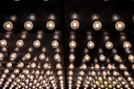 Round lights on the ceiling of the room.の写真素材