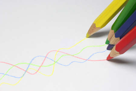 Painting pencils colored lines on a sheet of paper.の写真素材