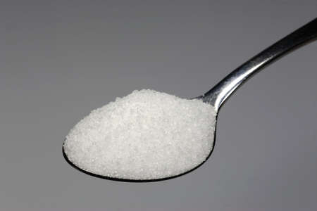 A spoonful of sugar sweeten many foods.の写真素材