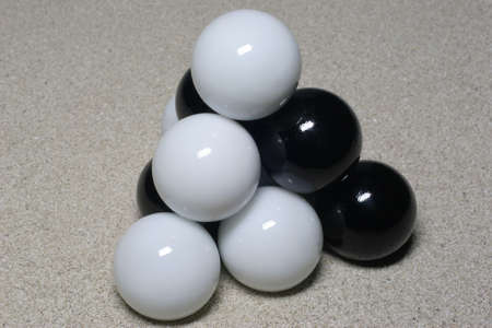 Black and white balls form a tetrahedron.の写真素材