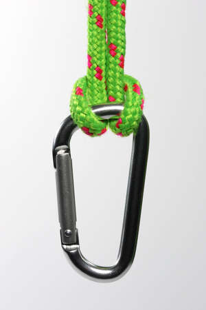 A hook with snap closure hanging from a rope loop.の写真素材
