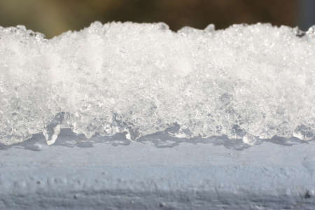 When it gets warmer, the snow melts.の写真素材