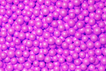 This picture with little plastic beads can be used as background.の写真素材