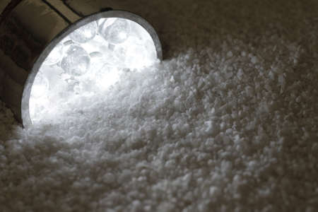 Some LEDs stuck half-buried in sand and shine bright.の写真素材