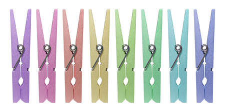 Wooden clothespins are against a white background.の写真素材