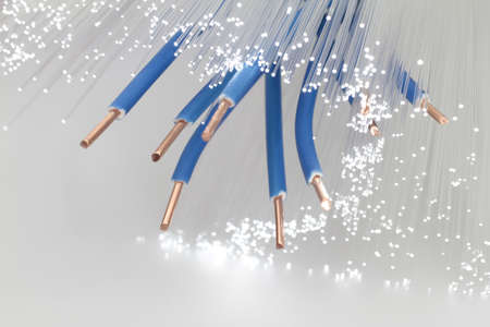 Data can be transmitted over copper wire and fiber optics の写真素材