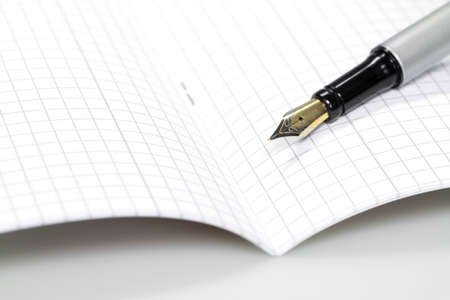 An exercise book lying open on a table 