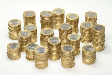 About 300 euro coins lying on several stacks 