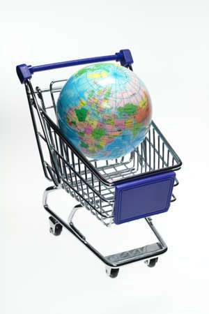 In a shopping basket is a small globe の写真素材
