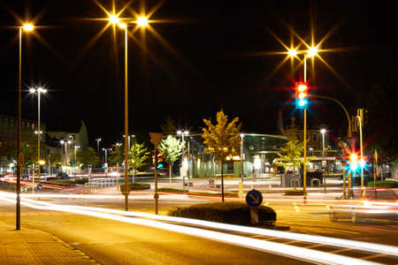 On the night propelled at a long exposure light trails produce cars with their headlights の写真素材