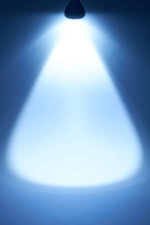 A beam of light comes from the top of an LED lamp の写真素材