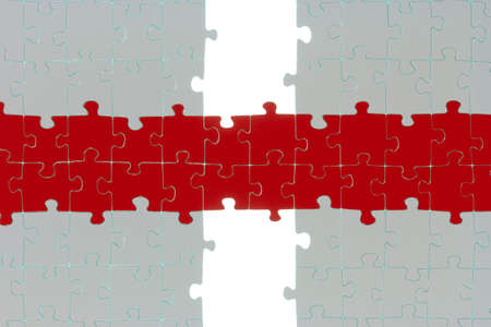 Two white puzzle halves are connected by a colored path の写真素材