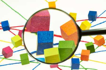Colorful wool threads form a network between colorful cubes の写真素材