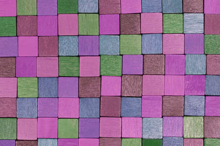 Colorful wooden blocks next to each other and forming 