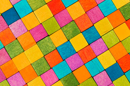 Colorful wooden blocks next to each other and formingの写真素材