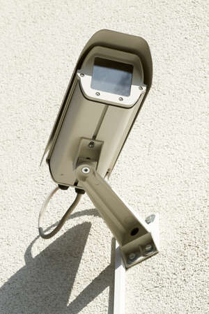 security camera mounted on a wall 