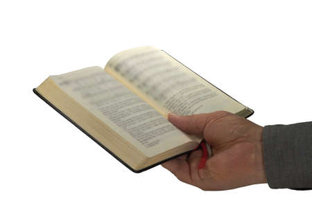 A book is held by one hand 
