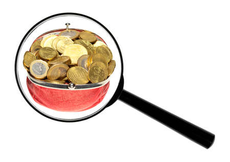 A magnifying glass against white background increases Euro-coins.の写真素材