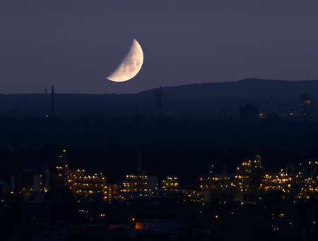 About a chemical plant is the bright moon.の写真素材
