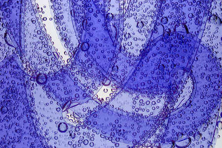 Curve rulers with gas bubbles are dipped in mineral water.