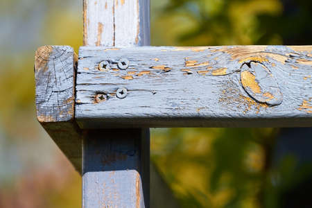 Old, weathered wooden beams with blue color in the sunshine.の写真素材