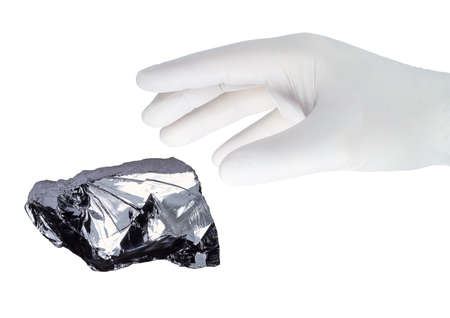 A hand in a white glove grabs.の写真素材