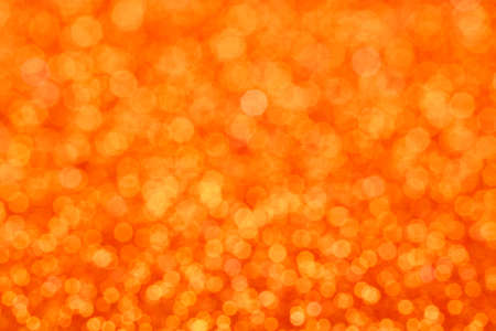 Background with tiny plastic tiles that glitter in bright light.の写真素材