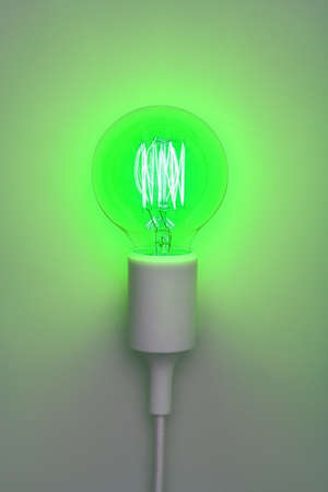 A bright lamp against a gray background.の写真素材