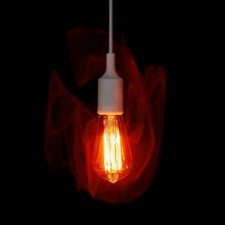 A particularly bright lamp against a dark background.の写真素材