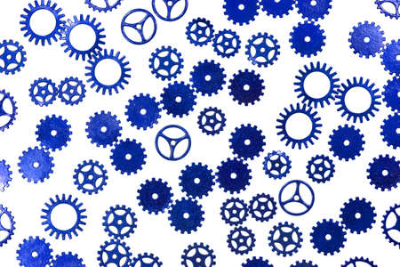 Several gears mesh with each other with their teeth.