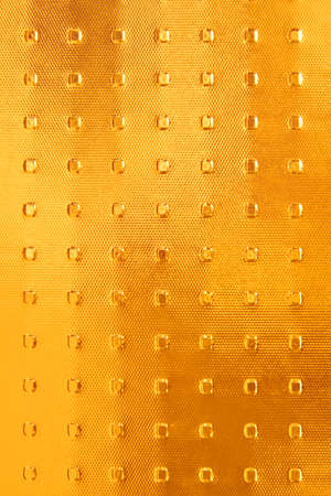 A textured colorful glass pane as a background.の写真素材