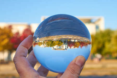 The Federal Chancellery in Berlin viewed through a glass ball.の写真素材