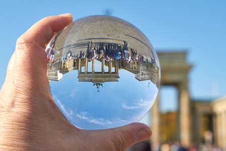 The Brandenburg Gate in Berlin viewed through a glass ball.の写真素材