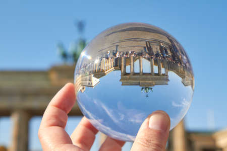 The Brandenburg Gate in Berlin viewed through a glass ball.