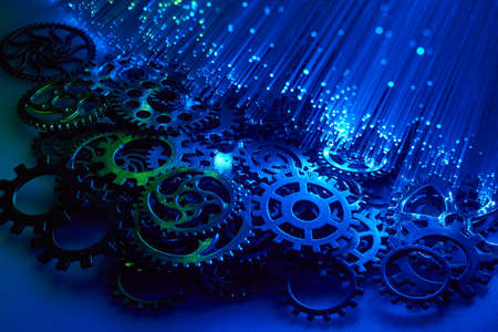 A pile of gears illuminated with fiber optics.の写真素材