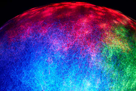 Fiber optics move and create colorful patterns.の写真素材