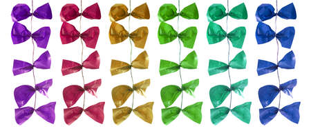 Colorful pieces of paper are tied on a ribbon and hang down.の写真素材