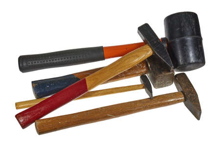 Several used hammers against a white background.の写真素材