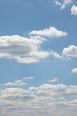 White clouds in the blue sky at noon in summer.