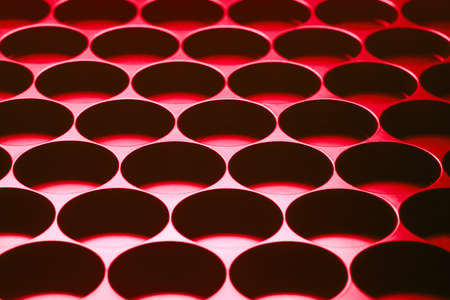 Shady background with small round holes.の写真素材